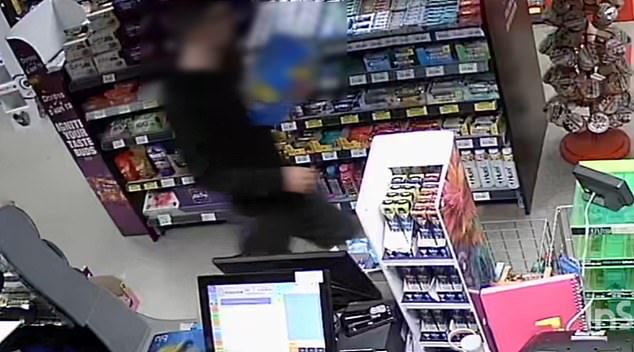 PICTURED: A man swipes an entire crate of beer from Andrew's shop in broad daylight