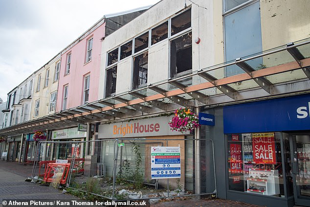 Empty units, betting shops, burnt out premises and charity shops lines Stepney Street, the town's main shopping area