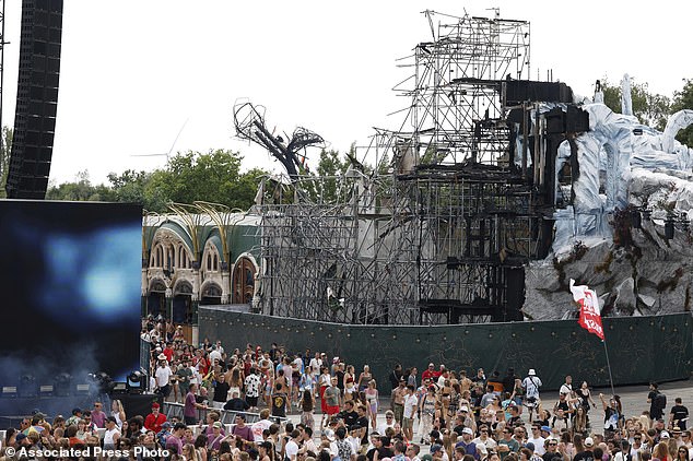 Having reportedly fell unwell at the festival, the woman was then taken to hospital where she was tragically pronounced dead. The public prosecutor's office in Antwerp said that the cause of her death has not yet been determined (Pictured: a crowd of festival-goers next to the burnt stage at Tomorrowland on July 18)