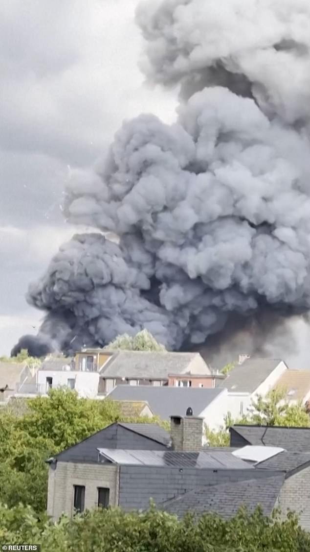 A cloud of dark smoke was seen billowing into the air near a residential area, while fireworks are also seen exploding uncontrollably in different directions into the sky and over houses