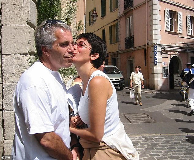 Maxwell, seen here kissing Epstein, worked inside the law library at FCI Tallahassee, according to Watkins