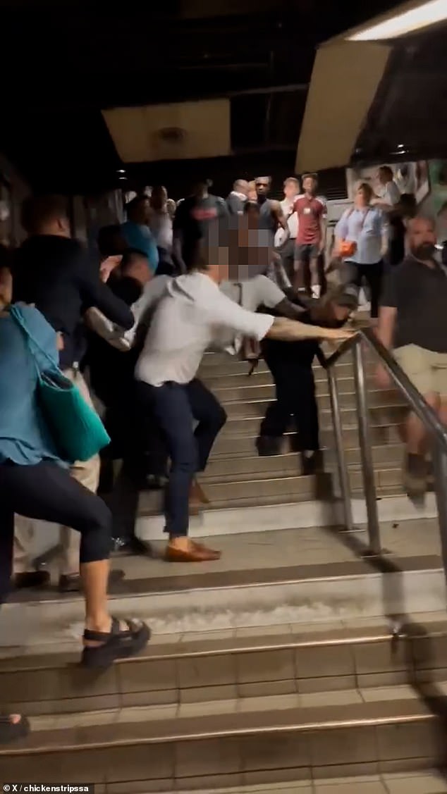 They man in the grey tracksuit at one point swung his legs in the air to try and kick his attackers