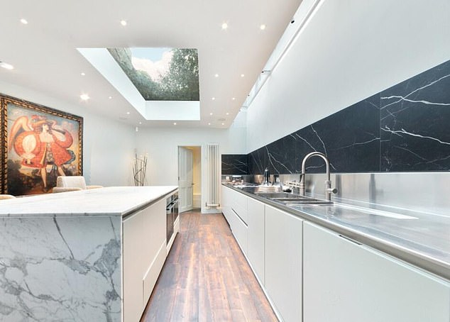 The interior of the house is packed with beautiful artwork, ornate Italian chandeliers and expensive designer furniture
