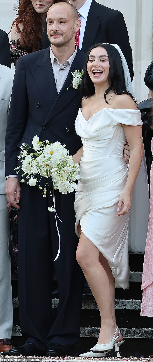 'The choice fits perfectly with the rest of her wedding look, as she wore a short white dress and sunglasses to her ceremony, skipping the usual formal bridal style'