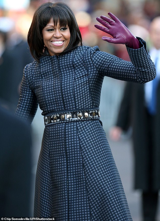 During her First Lady years, Obama's hair was a straightened helmet – as rigid as Lady Thatcher's famous shampoo and set. Pictured: Obama at her husband's inauguration in 2013