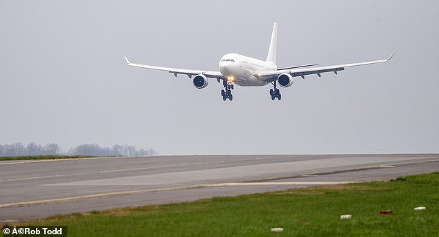 One of the Government's unmarked planes landing at Stansted Airport in Essex with 227 Afghans on board