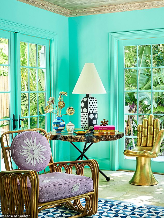 Walls painted Tiffany blue in the den evoke the Floridian Atlantic. The ‘Hand’ chair was designed by Pedro Friedeberg, the Mexican painter and sculptor, and it has travelled with the couple over the years.