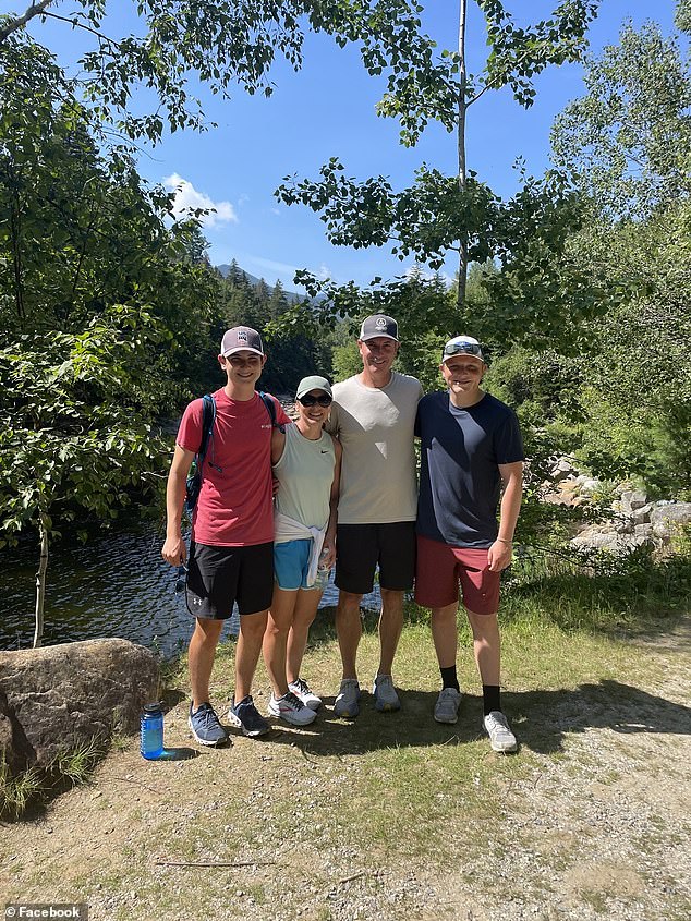 Another photo shows Andy Byron, his wife and their two children on a hike