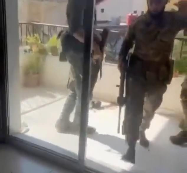 The unidentified militants were wearing camouflage and carrying machine guns