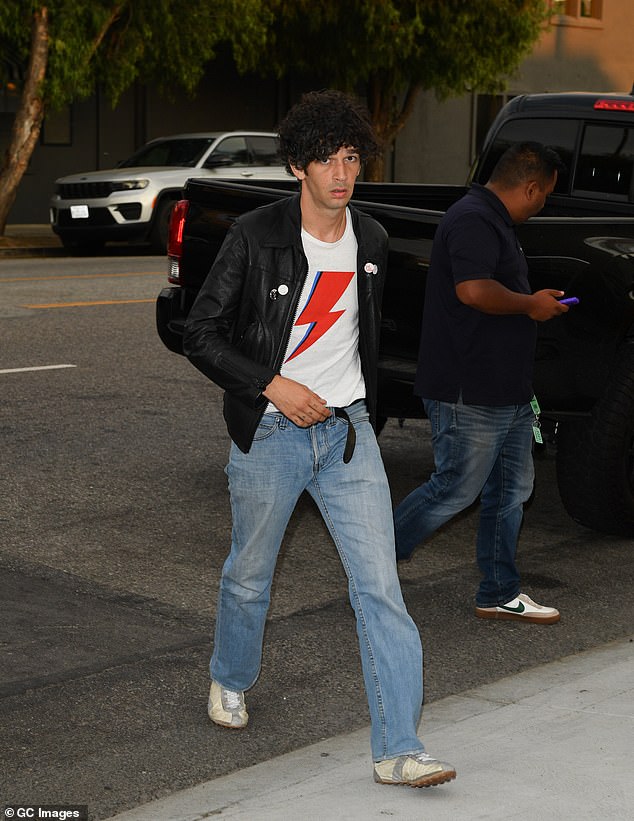The groom's bandmates Adam Hann and Ross MacDonald, however frontman Matty Healy (pictured in LA on Friday) was noticeably absent