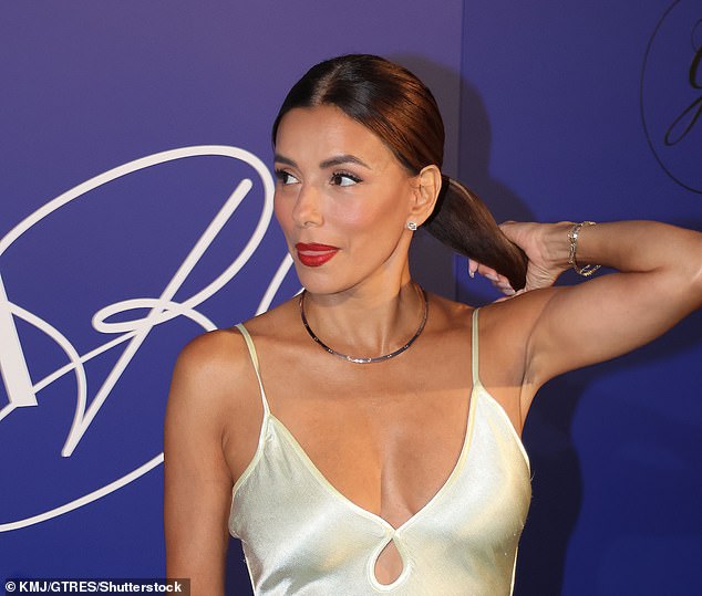 Her gorgeous dress boasted a racy keyhole detail which she accessorised with a simple gold necklace and diamond earrings