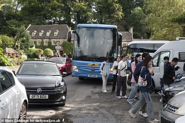 Residents say pedestrians are endangered by the volume of coaches that turn up, while the picture-perfect village turns chaotic
