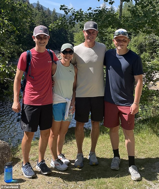 Another photo shows Andy Byron, his wife and their two children on a hike