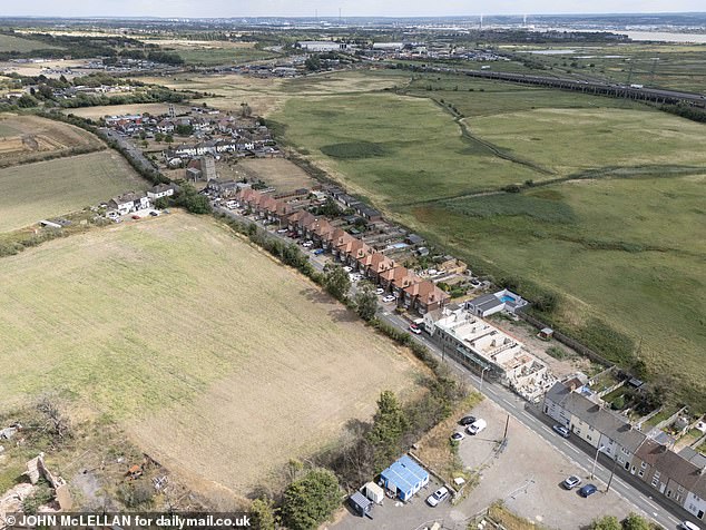 Drone pictures show deep scars on the grassland surrounding the village three years after the wildfire (Pictured: Wennington today)