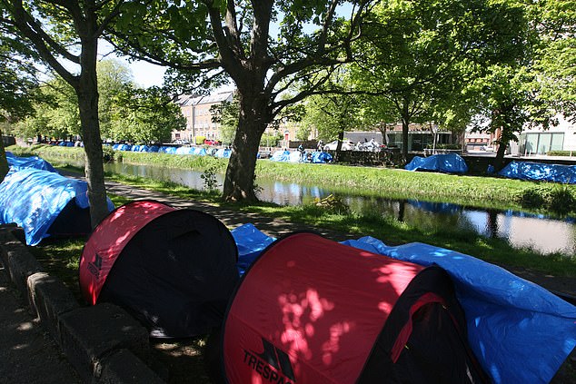 During just three days, an estimated 200 migrants are believed to have crossed into the Republic of Ireland in the same week. Pictured: asylum seekers tents seen on the Grand Canal bank at Warrington Place in Dublin in May 2024