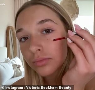 Across a 34 second clip, the teenager shows viewers how to correctly apply the blood red serum - described as an 'innovative liquid blush'