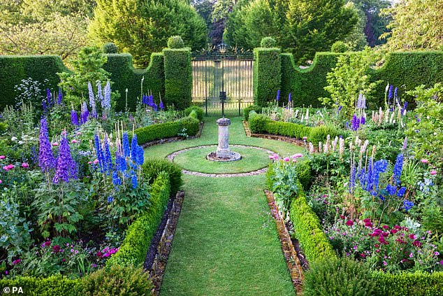 The Sundial garden in Highgrove is peppered with King Charles' favourite purple and blue delphiniums