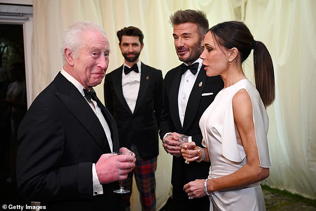 Constantine Innemee (back), executive director of Highgrove House, looks on as King Charles meets David and Victoria Beckham, in February