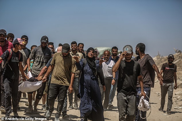 Injured Palestinians are transported to hospitals after Israeli forces fired upon them