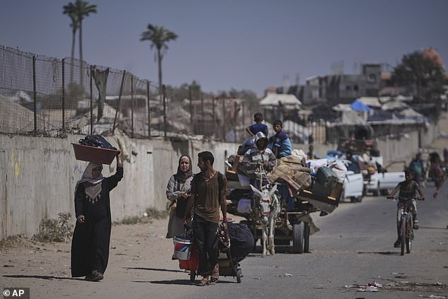 Palestinians flee Deir al-Balah in central Gaza on Sunday, July 20