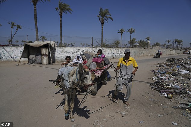 After Israel's military dropped leaflets urging people to evacuate from neighbourhoods in central Gaza's Deir al-Balah, residents said Israeli planes struck three houses in the area
