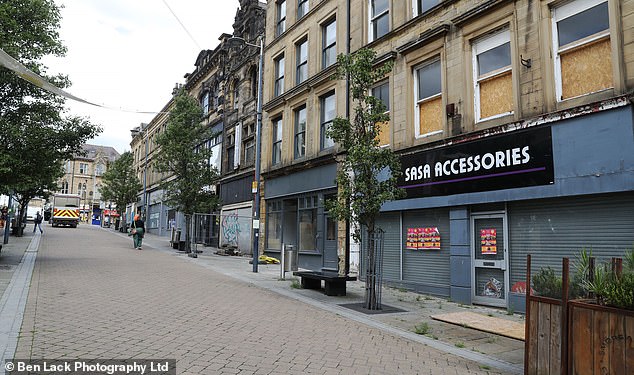 Some shopping streets are swarming with shoppers and the atmosphere seems vibrant. However, around every corner is a boarded up shop.