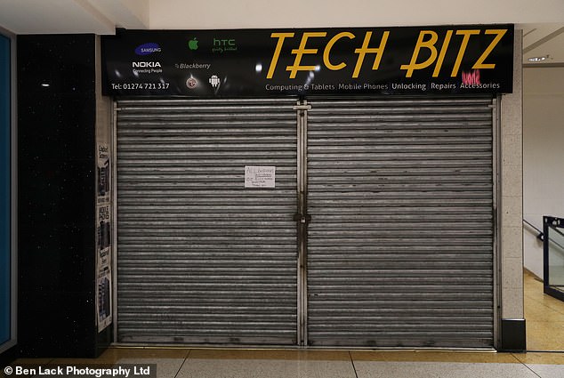 A phone shop pictured with its shutters down is another tell-tale sign the number of shops closed in the city centre is one of the highest in the country
