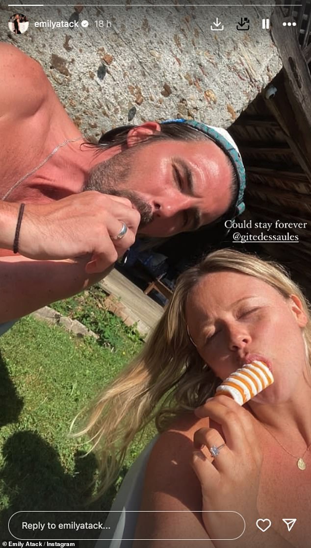 The Rivals actress, who announced the hunk had popped the question on Friday, looked gorgeous in a plunging black bikini top and colourful bottoms while soaking up the sunshine