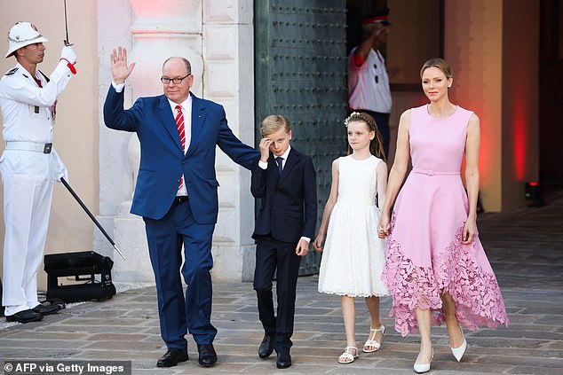 Albert, 67, and his wife Charlene, 47, were accompanied by their 10-year-old twins, Crown Prince Jacques and Princess Gabriella, as the royal family celebrated the joyous occasion at the Palace Square