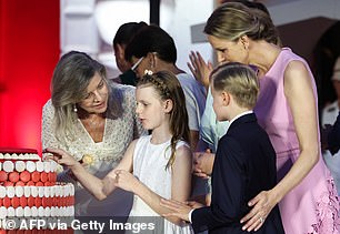The royal family cut the cake and offered it to their guests