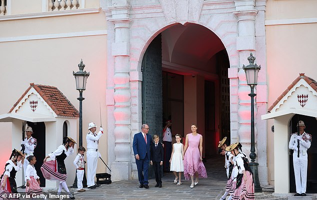 The prince looked exceedingly sharp in a royal blue blazer with matching trousers, a pressed white shirt, stripy red tie and polished black leather loafers