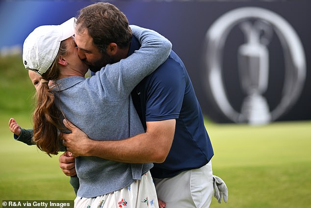 The world No 1 celebrated with his wife Meredith after completing his round to win the title