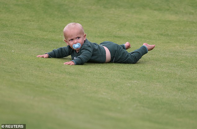 The one-year-old suffered an adorable mishap when he took a tumble on the 18th green