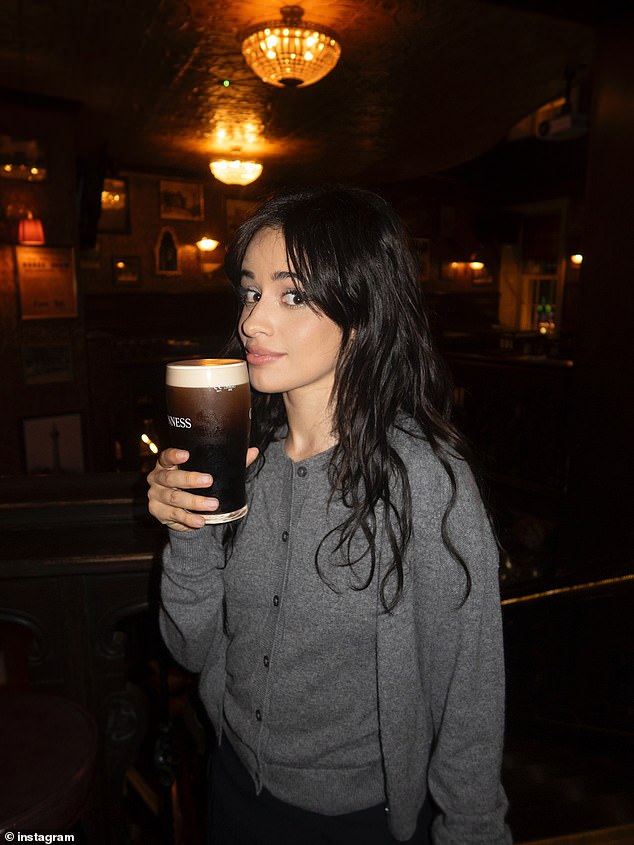 She kept low-key for the evening in a grey cardigan and stylish black mini skirt while at the J.R. Mahon¿s Public House & Brewery
