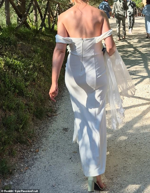 An outraged guest shared photos of the woman in question, revealing a white, floor-length gown with floral detailing