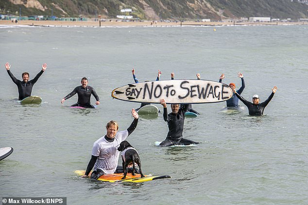 He said: 'It's failed the environment, we see the state of iconic lakes, like Windermere, beaches like the beach of Bournemouth'. Pictured: Protesters against the dumping of sewage, gathered at Bournemouth Pier, Dorset, in 2021