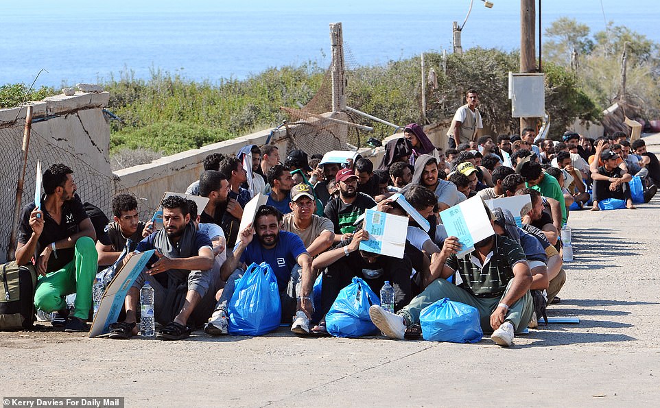 The Greek Coast Guard oversee the shipping out of Hundreds of migrants at Kitrenosi emergency camp which is stationed outside Rethymnon in Crete