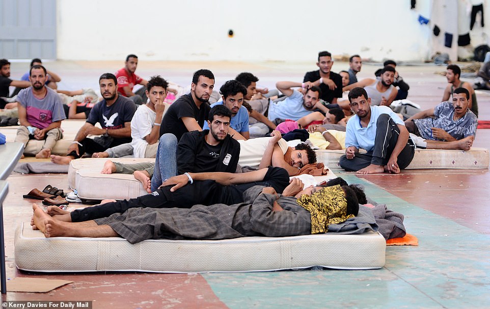 Some migrants were lying on mattresses, resorting to sharing because there are so few available in the Chania town warehouse
