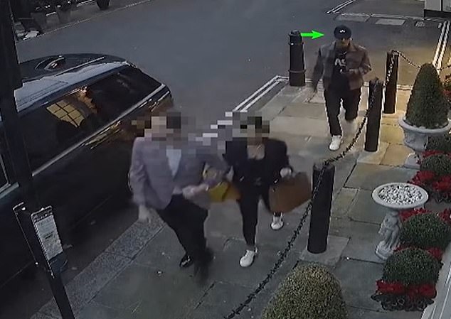 CCTV footage revealed the dramatic moment (pictured) a 'Rolex ripper' gang mistakenly target a pair of undercover police officer posing as a wealthy couple kitted with designer watches