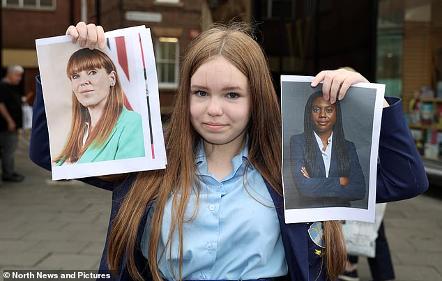 14-year-old Olive Irving holds up pictures of Angela Rayner and Kemi Badenoch. Few teens were able to name the deputy Prime Minister and the Conservative leader when shown pictures of them