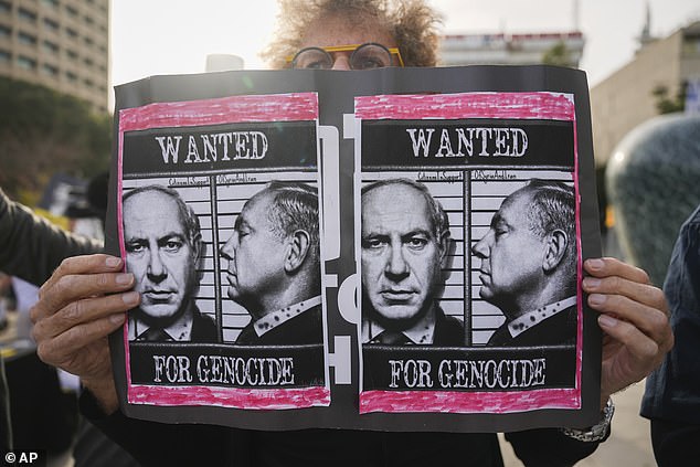 Demonstrators protest against Prime Minster Benjamin Netanyahu outside the court in Tel Aviv, December 10, 2024
