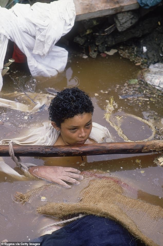 Omayra Sanchez floats in muddy water after being caught in a lahar as it flowed from the erupting Nevado del Ruiz volcano in Colombia. The 1985 eruption completely destroyed the town of Armero, killing 23,000 of its inhabitants