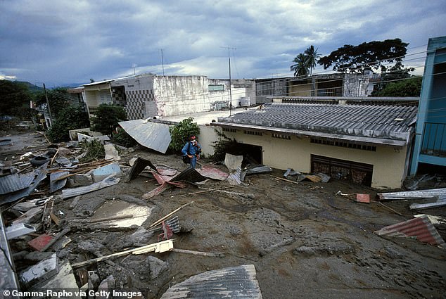 Red Cross rescue workers were forced to give up their efforts to save Omayra when it became apparent that they would not be able to give her life saving care. Picture shows destroyed homes in the town of Armero following the devastating Nevado del Ruiz eruption