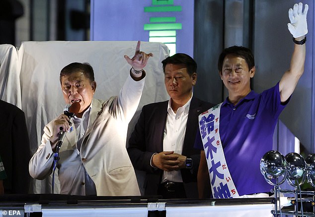 Japanese Prime Minister and President of the ruling Liberal Democratic Party Shigeru Ishiba (L) gives a speech in support of a candidate on the last day of campaigning for the 2025 House of Councillors election, in Tokyo, Japan, 19 July 2025