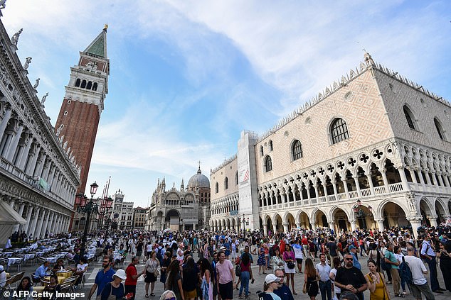 Tourists are seen filling St. Marks Square in Venice. Police officials say they expect up to 900 empty wallets to be found in the square this year amid a rise in pickpocketing