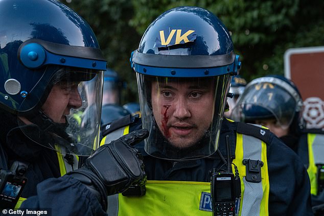 A police officer was seen with blood running down his cheek outside The Bell Hotel last night