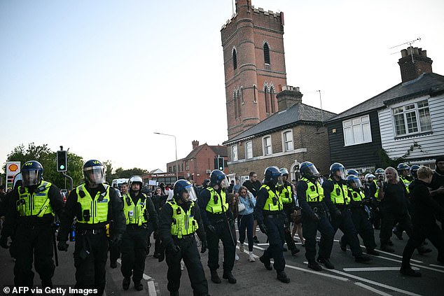 Riot police followed a march into the town centre as protesters gathered in the area a second time