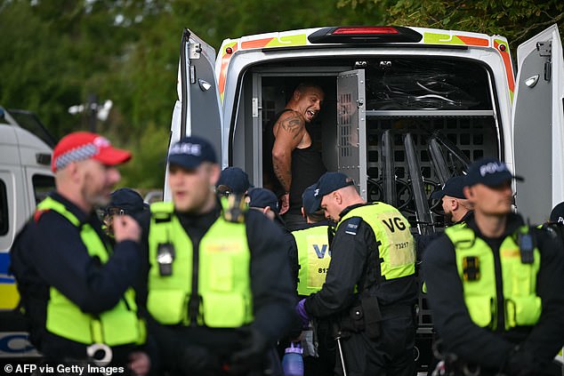A man was seen being put into the back of a police van at the Epping protests on Sunday night