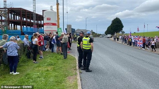 People gathered around the building site of the three-storey South Lakes Islamic Centre in Furness, Cumbria, on Saturday