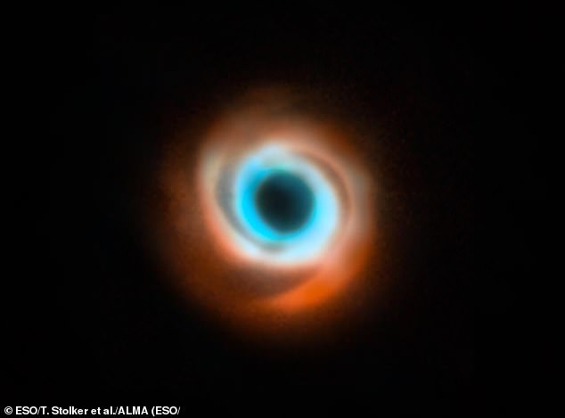 The star HD 135344B has a distinctive spiral pattern, which astronomers believe is caused by a young planet starting to disturb the cloud of gas and dust which spins around young stars